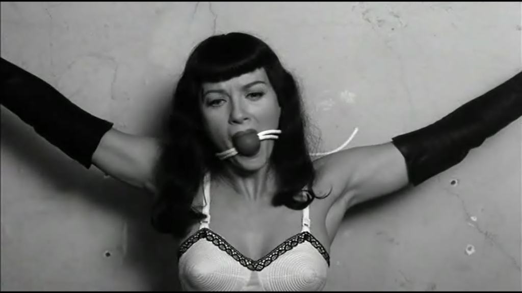 The Notorious Betty Page gets gagged for pictures